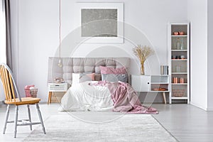 Pastel pink cozy bedroom with grey accents photo
