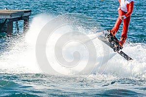 Horizontal View of Santa Claus on Flyboard on Blur Background