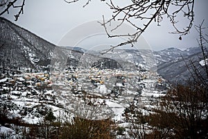 Horizontal View of the town of Terranova di Pollino in Winter, Covered with Snow photo