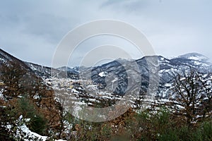 Horizontal View of the town of Terranova di Pollino in Winter, Covered with Snow photo
