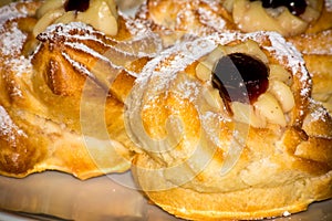 Horizontal View of Traditional Baked Italian Food Called Zeppole Made With Eggs, Cherries and Flour during Saint Joseph