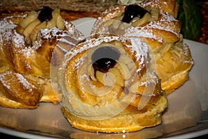 Horizontal View of Traditional Baked Italian Food Called Zeppole Made With Eggs, Cherries and Flour during Saint Joseph
