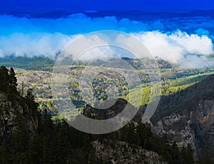 Horizontal vivid cloudscape in high altitude mountains