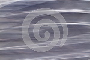 A Horizontal wavy blue grey abstract background