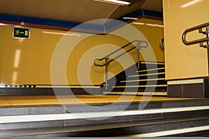 Horizontal yellow staircase in subway station in m