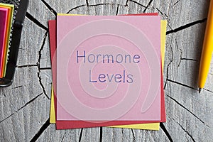 Hormone Levels written on a note