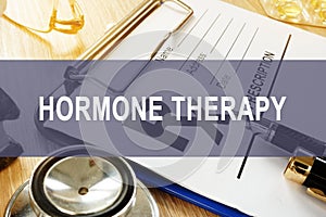 Hormone therapy concept. Prescription form and stethoscope.