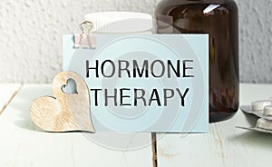 Hormone therapy -Diagnosis written on a white piece of paper. Treatment and prevention of disease. Syringe and vaccine