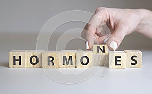 Hormones Word Written In Wooden Cube on white