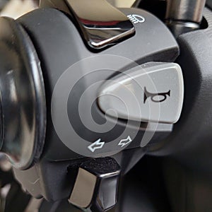 horn button, turn signal and lights on the motorcycle handlebar