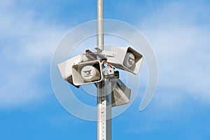 Horn speakers on top of pole