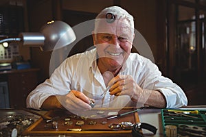 Horologist repairing a watch in the workshop