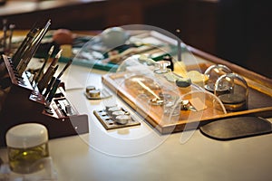 Horologist work tools and equipment on desk