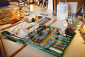 Horologist workshop with clock repairing tools, equipments and machinery photo