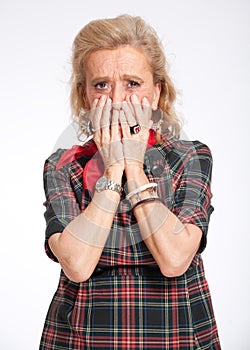 Horrified senior woman