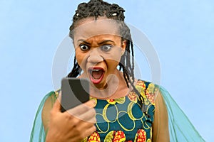 Horrified upset young African American woman photo