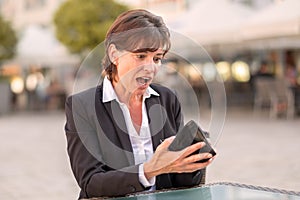 Horrified woman unable to pay her bill photo