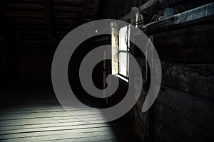 Horror background causing fear. Scary mystical mysterious dark attic room in an abandoned wooden old empty house with a