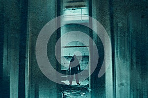 A horror concept of a hooded supernatural demon like entity with glowing eyes. Standing in an abandoned industrial building. With photo