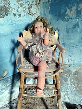 Horror doll on a chair