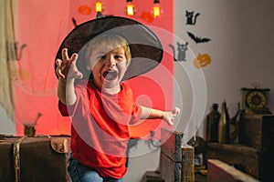 Horror face. Secrets of Magic for Happy Halloween. Halloween kids party and funny Pumpkin. Funny boy.