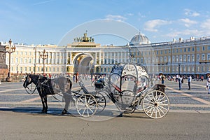 Horse carriage on Palace square with General Staff at background, St. Petersburg, Russia