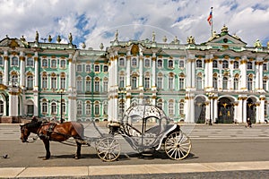 Horse carriage on Palace square and Hermitage museum at background, Saint Petersburg, Russia