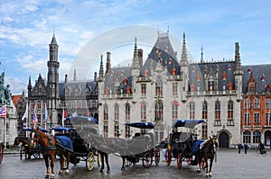 Horse carriages in front of Provinciaal Hof in Bruges