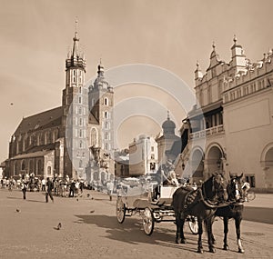 Horse carriages in front of Mariacki church Krakow