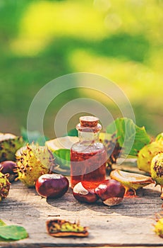 Horse chestnut extract in a bottle. selective focus.