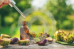 Horse chestnut extract in a bottle. selective focus.