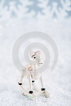 Horse christmas decoration on white snow background