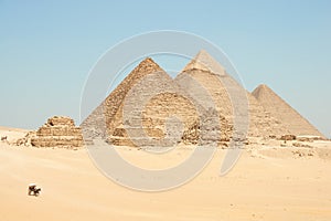 Horse drawn carts near Giza pyramids. Khufu, Khafre, Menkaure and pyramids Queens