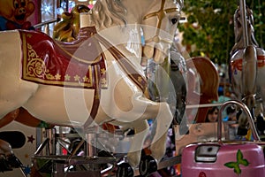 Horse in a French carousel in an amusement park. Large roundabout at the amusement park fair