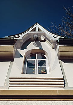 Horse head decorating top part of window, old house