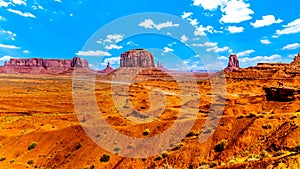 Horse at John Ford Point and towering red sandstone formations of Sentinel Mesa, Merrick Butte, Mitten Buttes in Monument Valley