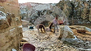 Horse and little pony in Goreme in Cappadocia, Turkey