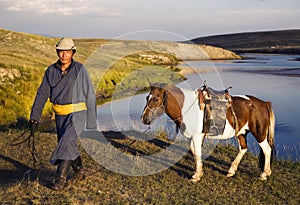 Horse man walking with his horse