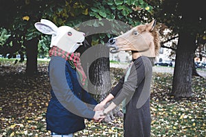 Horse and rabbit mask women in the park