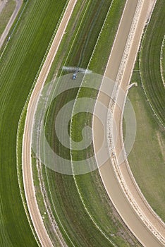 Horse Racing Track With Maintenance Tractor From Aerial Perspective