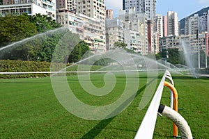 Horse racing track with sprinkling water