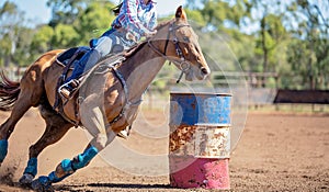 Horse And Rider Competing In Barrel Race At Outback Country Rodeo