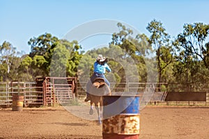 Horse And Rider Competing In Barrel Race At Outback Country Rodeo