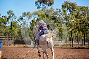 Horse And Rider Competing In Barrel Race At Outback Country Rodeo