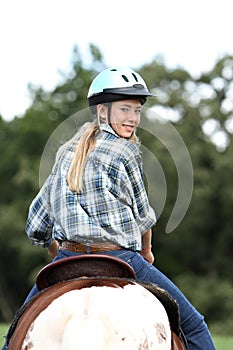 Horse rider looking back