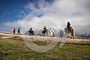 Horse riders on the Montebaldo mountain, Malcesine, Italy photo