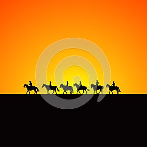 Horse riders silhouettes at sunrise photo