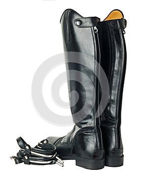 Horse riding dressage boots and spurs isolated on white