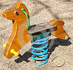 Horse shaped teeter at the playground