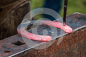 Horse shoe being crafted by blacksmith/farrier